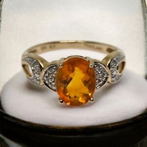 Elegant Gold and Silver Ring with Orange Gemstone